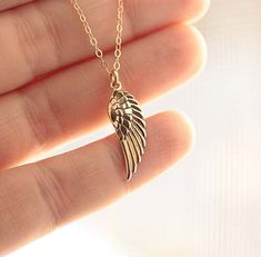 "Angel Wing Necklace♥ ♥Delicate & shimmering flat cable chain, 18 inches standard size. Gold fill or sterling silver. ♥Beautifully detailed angel wing pendant, available as a tiny charm (15mm) and a larger pendant (30mm). Please see photos for size differences! Solid sterling silver, or solid bronze (for the gold fill version). ♥Necklace is completed with a spring clasp, securely wire wrapped to the chain. ♥Your purchase will come thoughtfully packaged and ready for gift giving. If this purc Gold Nickel-free Necklace For Memorial, Rose Gold Sterling Silver Necklace, Missoma Jewellery, Pretty Jewelry Necklaces, Angel Wing Necklace, Natural Gemstone Necklace, Tiny Charm, Bereavement Gift, Friendship Necklaces