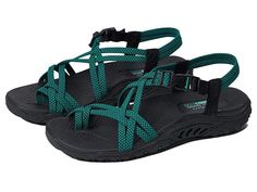 SKECHERS Reggae - Irie Mon - Women's Shoes : Black/Teal : The SKECHERS Reggae - Irie Mon sandal boasts comfort and eye-catching style with a river-style design, woven straps, and an open toe. Stretch fabric upper material. Quick-access buckle closure at the ankle. Adjustable side tab offers a custom fit. Breathable fabric strap lining. Contoured and cushioned insole lends to all-day comfort. Shock-absorbing midsole. Flexible rubber traction outsole. Imported. Measurements: Weight: 8 oz Product m Summer Sandals With Single Toe Strap For Outdoor, Vacation Sandals With Adjustable Strappy Design, Beach Sandals With Adjustable Straps And Strappy Design, Casual Sport Sandals With Single Toe Strap For Vacation, Adjustable Open Toe Sport Sandals For Vacation, Strappy Sandals With Adjustable Straps For Vacation, Beach Sport Sandals With Ankle Strap And Removable Insole, Adjustable Single Toe Strap Sport Sandals For Summer, Beach Sport Sandals With Removable Insole And Ankle Strap