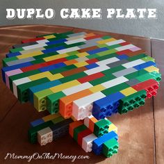 a table made out of legos with the words duplo cake plate on it