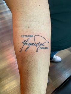 a man with a tattoo on his leg that says,'stay together'in cursive writing