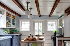 the kitchen is clean and ready to be used for cooking or baking, while also being used as a dining area