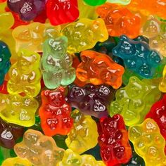 many different colored gummy bears are stacked on top of each other