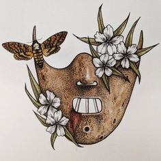 a drawing of a face with flowers and moths on it