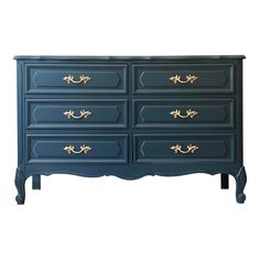 a blue dresser with gold handles on it's sides and drawers, against a white background