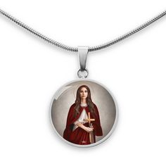 The St. Mary Magdalene Pendant Necklace is handcrafted from Surgical Steel or 18k Gold finish with a hand-poured liquid glass dome. The durable charm measures 0.9" diameter (about the size of a quarter) and comes with an adjustable 18"- 22" luxury chain. A truly beautiful accessory that makes a lovely and unique gift. ■ Silver: Surgical Steel■ Gold: 18k Gold Finish■ Handmade in the USA This is a couture item which is custom made-on-demand. Our couture collections feature exclusive, custom designs with our signature crown somewhere within the design. Not sold in stores and you won’t find this anywhere else. EXCLUSIVELY AT VENXARA. Jesus Tomb, St Mary Magdalene, Lady Of Fatima, Mary Magdalene, Saved By Grace, Catholic Gifts, St Mary, Glass Dome, Sacred Heart