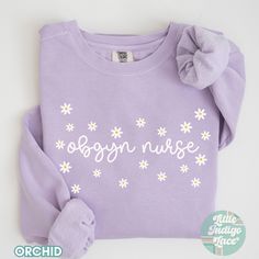 OBGYN Nurse Sweatshirt in a cute & fun minimal design. Perfect gift for your favorite OB RN!   Each sweatshirt comes with a relaxed fit, a rolled-forward shoulder, and a back neck patch. This is a Comfort Colors sweater.  ♡80% ring-spun cotton, 20% polyester ♡Medium-heavy fabric (9.5 oz /yd² (322.1 g/m ♡Relaxed fit ♡ DISCLAIMERS: - Colors may vary depending on the device you are viewing them on This item is made especially for you as soon as you place an order so it can take a little longer to d Cotton Nursing-friendly Relaxed Fit Sweatshirt, Cotton Relaxed Fit Nursing Sweatshirt, Obgyn Nurse, Obstetrics Nursing, Ob Nurse, Nurse Sweater, Nurse Crewneck, Ob Nursing, Nurse Sweatshirt