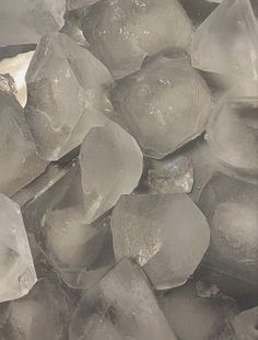 some ice cubes are sitting on top of each other