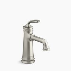 a brushed steel faucet on a white background