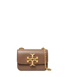 Directly from Tory Burch - Signature hardware, scaled-up in sculptural brass. The Eleanor Small Bag is a structured shape in soft Italian leather - with edges that are painted by hand, to emphasize the clean lines. Its twisted rope chain is convertible: wear it doubled or long and crossbody. Tory Burch Official Site. Womens Designer Handbags, Signature Hardware, Designer Shoulder Bags, Rope Chain, Small Bag, Italian Leather, Clean Lines, Designer Handbags, Designer Shoes