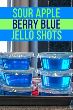 blue jello shots in plastic containers with text overlay that reads sour apple berry blue jello shots