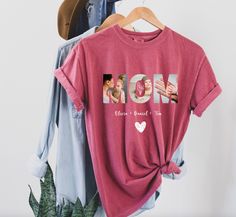 Create a truly personalized gift for mom with our custom mom shirt! Each shirt features the word 'mom' spelled out using three cherished photos, one for each letter, and the names of her children and her birth flower. Here's how to order: Please place your order on our website. After placing your order, email us at hello@jazzyandglitzy.com with the following: Three photos, one for each letter in 'mom.' Names of your children Mom's birth flower We'll generate a proof of your design and send it to Personalized Graphic Tee For Mother's Day, Personalized Name Print T-shirt For Mother's Day, Mother's Day Personalized Name Print T-shirt, Personalized Family T-shirt For Mother's Day, Personalized Mother's Day Cotton Top, Personalized Tops For Mother's Day, Personalized Tops For Family Occasions On Mother's Day, Customizable T-shirt For Mother's Day, Personalized Mother's Day T-shirt