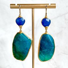 Enhance Your Style With These Stunning Handmade Earrings Featuring Lapis Lazuli And Aquamarine Stones. The Top Section Features Bold Lapis Stones And Dangling Below, The Aquamarine Stones Add A Touch Of Oceanic Elegance With Their Unique Shapes And Vibrant Blue-Green Shades. Set In Gold-Tone Frames, These Earrings Offer A Perfect Blend Of Luxury And Natural Beauty, Ideal For Any Occasion. - Top: Lapis Stone - Bottom: Aquamarine Stone - 14k Gold Plate - 2.5”L, 3”L Total Top Of Hook - 1”W (Bottom Fusion Style Blue Gemstone Earrings, Blue Fusion Style Drop Earrings, Blue Fusion Drop Earrings, Blue Teardrop Fusion Earrings, Lapis Stone, Stone Drop Earrings, Green Shades, Unique Shapes, Earrings Turquoise