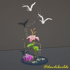 some birds are flying around a flower vase