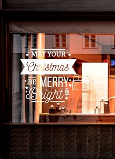 there is a sign that says merry and bright in the window