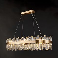 a large chandelier with many lights hanging from it's sides and glass tubes on the bottom