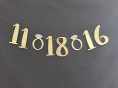 a banner with numbers and birds hanging from it's sides on a string in the shape of letters