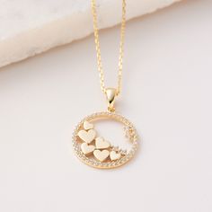 "To whom Hearts are flying to? Hearts surrounded with a Circle Pave Cz Pendant Necklace , Solid Gold 10K 14K 18K, CZ Simulated Diamond, Jewelry for everyday wear  Sizes of the *Flying Hearts Pendant* * 0.70inch /  17mm (excluding bail) * 0.85inch /  22mm (including bail) * 100% 10K 14K 18K Solid Yellow Gold (Not Gold Vermail or Not Gold Plated) * Price includes the chain when \"Pendant and Chain option\" is chosen. * Cubic Zirconia clear simulated diamonds * Channel set Cz and Plain Hearts Pendant is a lightweight item. * Polished finish EU and UK taxes; *EU and UK orders over £135/€150 are subject to customs, import duties and tax charges once they reach their destination. This means that the recipient will be responsible for all customs, import duties and sales taxes that may apply at Eu Yellow Gold Heart Pendant Necklace For Gift, Yellow Gold Plated Heart Pendant Necklace, Gold-tone Heart Pendant Necklace For Gift, Valentine's Day Heart Pendant Yellow Gold Diamond Necklace, Gold-tone Heart Pendant Necklace For Valentine's Day, 18k Gold Jewelry, Heart Pendant Gold, Solid Gold Earrings, Gold Gift