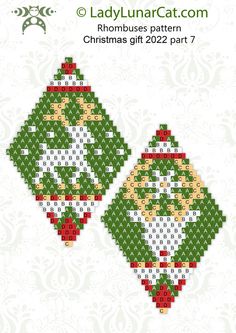 two cross stitch christmas ornaments in green and red