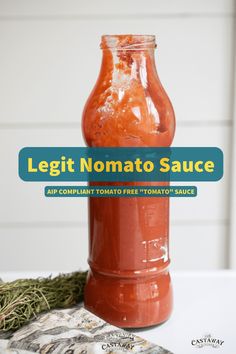 a jar filled with tomato sauce sitting on top of a table