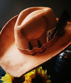 Custom burned wide brim cowboy hat for men. This creation has tons of features including dummy bullets, feathers, and a play card. Each hat is made to order and recreated each time there is a purchase. All hats have an adjustable ribbon on the inside of the hat. Hats maybe slightly darker in person due to Camara flash. Western High Crown Costume Hat For Rodeo, Western Brimmed Costume Hats For Rodeo, Western Costume Hats And Headpieces For Country Events, Western Flat Brim Costume Hat For Rodeo, Western Fedora Costume Hat For Rodeo, Custom Brown Top Hat For Western-themed Events, Western Fedora For Rodeo Costume, Western Fedora Hat For Rodeo, Western Style High Crown Top Hat For Festival