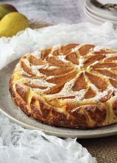 a cake on a plate with the words no crust italian pear and ricotta cheesecake