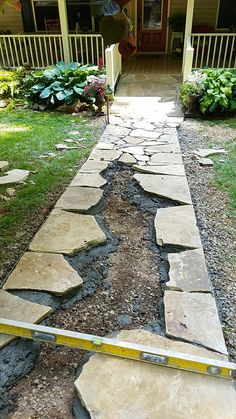 a stone path leading to a front door