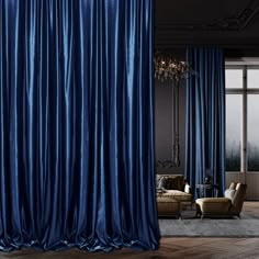 a living room filled with furniture and blue curtains