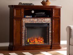 an entertainment center with a fire place in it