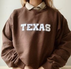 This very comfy and trendy TEXAS sweatshirt is perfect for lounging in this cozy fall and winter season! This is also perfect for gifting to your loved ones! Please note that the letters are patches and are heat pressed, NOT embroidered. Purchasing this means you are aware and accept that. Our sweatshirts run in a UNISEX fit. The sweaters naturally have a slightly oversized fit giving extra room for moving around and comfort! For this reason, we highly recommend getting your true normal size esp Brown Relaxed Fit Sweatshirt With Letter Print, Relaxed Fit Brown Sweatshirt With Letter Print, Retro Brown Crew Neck Sweatshirt, Fall College Brown Tops, Brown Letter Print Sweatshirt For College, Brown Cotton Sweatshirt With Letter Print, Cozy Brown Cotton Top, Brown Sweatshirt For College In Fall, Brown Cotton College Sweatshirt