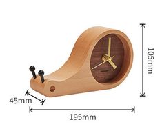 a wooden clock with two screws on the front and one in the back side