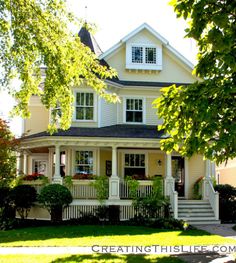 a house with white trim and black roof