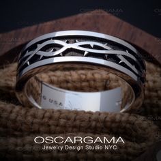 Made to order. Please allow 10 days for production.  This wedding band is perfect for the modern gentleman who wants something unique and special. The crown of thorns design is inspiring, and makes a bold statement. The black rhodium finish gives it an extra touch of luxury, while the 14k solid white gold construction ensures durability. It features a 6mm wide design with a crown of thorns motif and black rhodium. This bold and distinctive design draws inspiration from the iconic crown of thorns Viking Wedding Band Men, Christian Wedding Bands, Lotr Mens Wedding Band, Crown Of Thorns Wedding Band, Mens Celtic Wedding Bands, The Crown Of Thorns, Men Wedding Band, Minerals Crystals Stones, Jewelry Design Studio