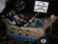 a child's pirate boat costume with skull and crossbones on the side