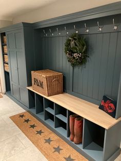 the entryway is decorated in blue with stars and wreaths hanging on the wall