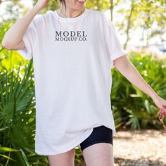 Gildan 64000 White Oversized Tshirt Mockup D E T A I L S This mockup image is for Gildan 64000 White (Unisex T-Shirt Mock up) * 64000 Gildan Oversized Adult T-Shirt * High Resolution White Gildan Mockup Tshirt * Female Beach Model Mockup Perfect for Summer (Model Wearing Size Large) U S A G E How do you use our mockups? EASY! Just place your design on our beautiful model mock up and start selling! R E M E M B E R, after purchase, this image can be used for personal and commercial use. You may no Oversized T-shirt With Custom Print, Oversized Custom Print Short Sleeve T-shirt, Oversized Short Sleeve T-shirt With Custom Print, Oversized T-shirt With Custom Print And Short Sleeves, Oversized Short Sleeve Shirt With Branding, Oversized Short Sleeve Tops With Branding, Branded Relaxed Fit Short Sleeve Shirt, Relaxed Fit Short Sleeve Shirt With Branding, Relaxed Fit Short Sleeve Branded Shirt