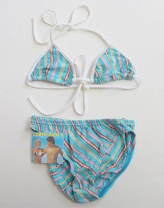 French vintage 70/80's, very bikini / bathing suit, striped cotton jersey, silver thread. Brand " Porto-Rico ". Estimated size 8 years ( tagged 10 years ) Vintage condition level 5, new old stock We assess the condition of our vintage items on a scale from 0 to 5. Level 5 corresponds to an almost new vintage condition. Any defects are systematically reported. Even though in very good condition, vintage items may present imperfections due to their age, which mainly adds to their charm. I am fond Beachwear Swimwear With Triangle Top For Play, Playful Cotton Swimwear For Poolside, Cotton Swimwear For Sunbathing In Spring, Summer Cotton Swimwear For Play, Striped Stretch Triangle Top Swimwear, Cotton Summer Swimwear For Sunbathing, Vintage Blue Swimwear For Swimming, Playful Striped Swimwear For Poolside, Spring Striped Cotton Swimwear