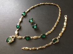 "** This listing come with a necklace together with a matching bracelet and a pair of earrings. ** Romantic oval shaped necklace embellished with clear rhinestones crystals and green glass stones on top and linked to cable chain. Size: necklace measures around 18.5\" long and center around 1.6\" drop x 0.75\" width. Bracelet around 8.6\" long x 0.55\" width and earrings around 0.6\" long x 0.45\" width Color: gold with clear rhinestone crystals and green glass stones ** Please note we need to ta Emerald Wedding Jewelry, Gold Necklace Emerald, Gold Wedding Set, Emerald Green Wedding, Something Green, Jewelry Emerald, Rhinestone Headpiece, Necklace Emerald, Emerald Green Weddings