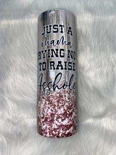 a red and white glittered tumbler with the words just a girl who is trying to raise herself