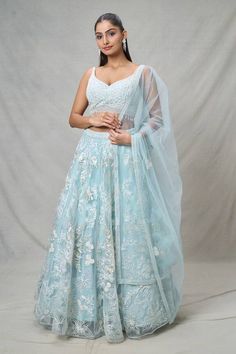 Blue attached cancan lehenga with floral applique thread embroidery. Paired with a floral thread embroidered padded blouse with a tasseled hem and embroidered dupatta. - Aza Fashions Blue Anarkali Set With Floral Embroidery For Wedding, Blue Floral Embroidery Anarkali Set For Wedding, Blue Floral Embroidered Sharara For Wedding, Blue Floral Embroidery Sharara For Wedding, Blue Organza Lehenga With Floral Embroidery, Light Blue Resham Embroidery Choli For Wedding, Fitted Light Blue Embroidered Lehenga, Festive Light Blue Lehenga With Intricate Embroidery, Anarkali Sets With Floral Embroidery In Lace