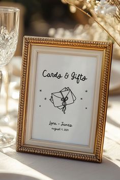 a gold frame holds a card and gift for someone to put on their wedding day