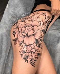 a woman's thigh with flowers on it