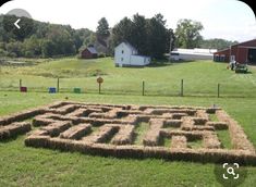 a large hay maze in the middle of a field