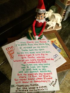 an elf is sitting on top of some paper with the letter from his friend to him