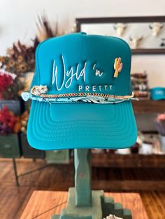 All the cool kids are wearing our Wyld 'n Pretty Trucker Hats! Add some embroidered patches or enamel pins for some extra flair! One size fits most. Bison Art, Custom Trucker Hats, Hat Patches, Hat Ideas, White Turquoise, Concert Tees, Hat Pins, Custom Hats, Western Outfits