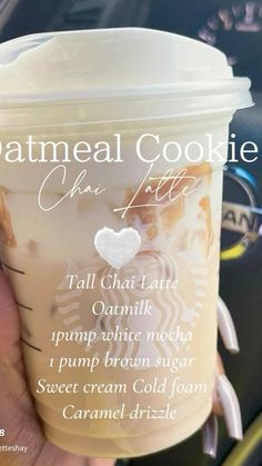 someone is holding up a starbucks cup with the words,'oatmeal cookie latte '