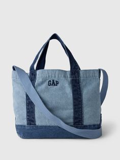 Soft cotton denim mini tote bag.  Top handle straps and long shoulder strap.  Inner pocket with zipper.  Embroidered mini Gap arch logo at front.  Responsibly Made: This denim bag s is part of our water-saving Washwell program.  Compared with conventional wash methods, Washwell uses at least 20% less water and has saved over a billion liters of water since 2016.  Dimensions: 10" H x 5" W x 16" L Utility Tote Pattern, Warren Peace, Xmas 2024, Gap Logo, Arch Logo, Xmas List, Perfect Purse, Denim Tote Bags, Water Saving