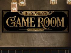 the stanley's game room sign is hanging on the wall next to some lights