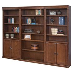 a wooden bookcase with many books on it's sides and two doors open