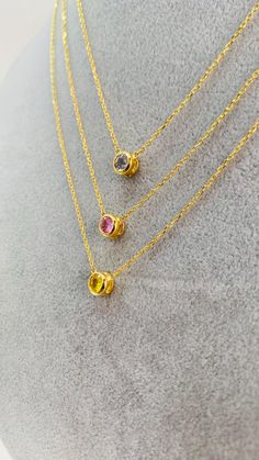 ✨ Enjoy a special 35% discount till CYBER MONDAY ! ✨  Free express shipping plus two gifts: a jewelry cleaner and organizer box. Don't miss out!  Discover elegance with our exclusive collection of 18k gold sapphire necklaces! Featuring stunning bezel-set sapphires in light blue, fancy pink, and fancy yellow, each piece is designed to add a touch of sophistication to any outfit. Perfect for any occasion, these necklaces offer timeless beauty and unmatched quality. Shop now to elevate your jewelry Yellow Sapphire Jewelry As A Gift, Pink Sapphire Round Necklace For Gifts, Gold Sapphire Round Birthstone Necklace, Pink Sapphire Gemstone Necklace, Sapphire Necklace With Bezel Setting As Gift, Gold Sapphire Birthstone Necklace, Fine Jewelry Pink Sapphire Necklace, Fine Jewelry Pink Sapphire Round Necklaces, Pink Necklace With Bezel Setting For Gift