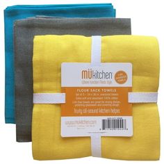 two yellow and grey towels are next to each other on a white background with a tag that says multi kitchen